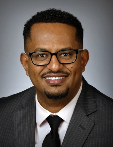 A portrait of Amaha Sheferaw, Chief Program Officer for Cooperative Christian Ministry.